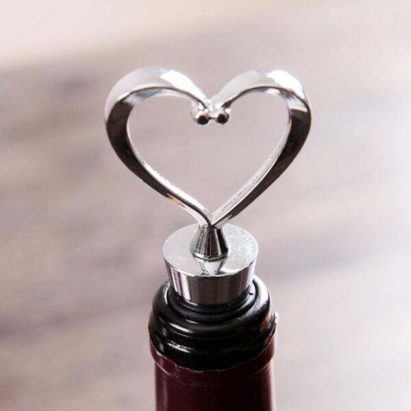 Heart Shaped Wine Bottle Sealer Standing on Wine Bottle In Bottle Focused